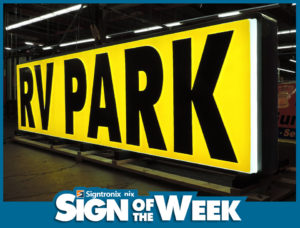 Sign of the Week for RV Park with Black Lettering on a Yellow Background - Home Page